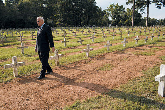 SIGNS OF THE CROSS Pickett visits the condemned dead of Texas at their eternal home.
