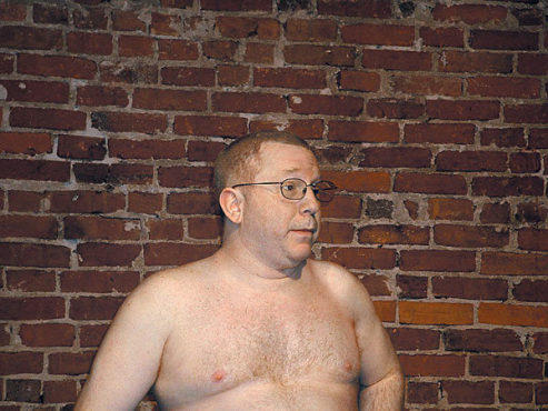 NAKED AMBITION Ofiesh diddles with the mike.