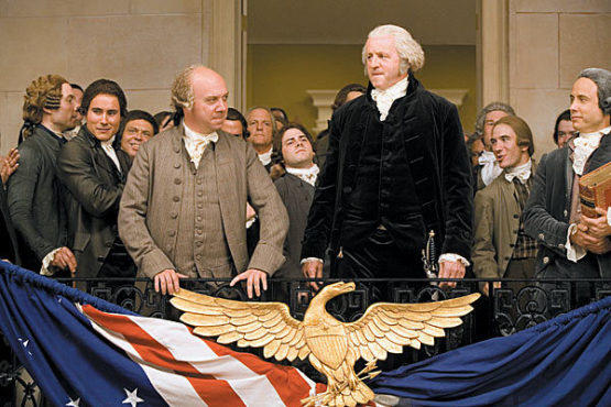 FATHERS’ DAY George Washington (David Morse, right) and John Adams (Giamatti) survey the crowd at their inauguration.