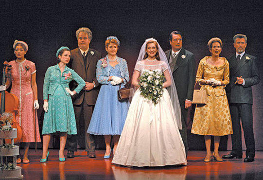 BRIDE AND JOY Grant, center, gets ready to toss her bouquet.