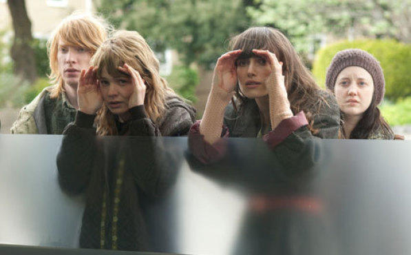 WINDOW WATCHING Mulligan and Knightley play peekaboo