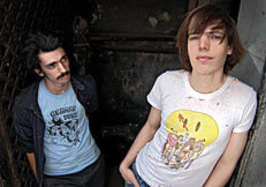 NAME THAT TOON The singer (and comic book artist), right, with his brother and bassist Jack.