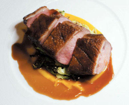 Duck breast with caramelized brussels-sprout leaves and duck jus