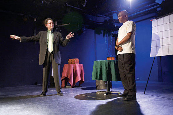 GOING MENTAL Eaton, left, picks the brain of an audience volunteer.