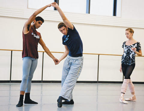 SHAPING UP Maria Kowroski looks on as Douglas Lee, center, works out a step with Amar Ramasar.