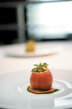 Heirloom tomato stuffed with corn, summer squash and eggplant