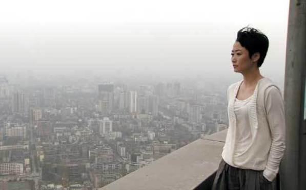 ROOM WITH A VIEW Zhao gazes out at the city of Chengdu