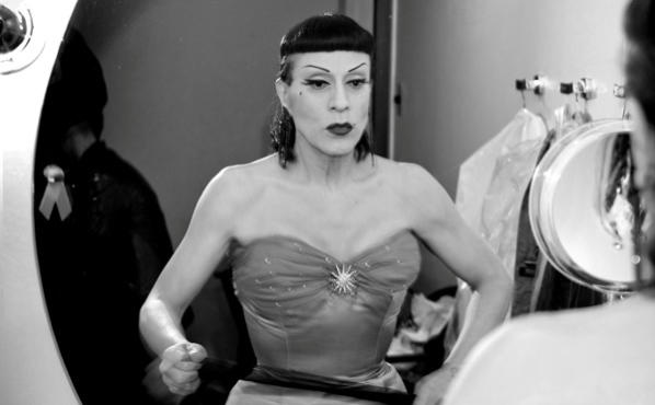 THROUGH THE LOOKING GLASS Arias prepares for the spotlight.