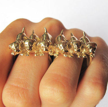 VeraMeat two-finger ring with a row of brass puppies, $170