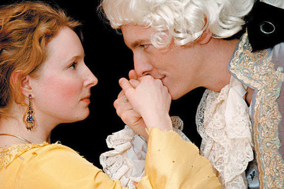 HANDY MAN Jones, left, receives a courtly kiss from Phillips.