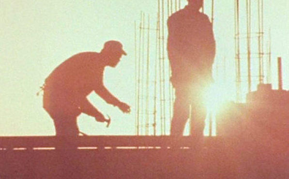 SUNRISE, SUNSET Two workers go about their day