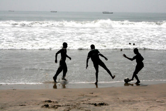 Playing football on Kokorobite Beach near Accra