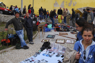 Go shopping at Feira da Ladra in Lisbon, Portugal