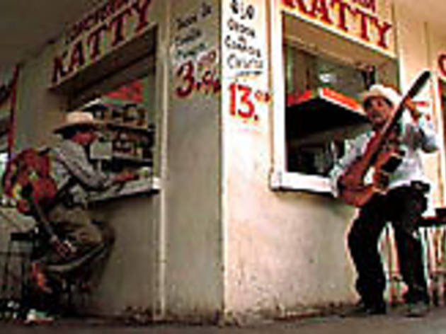 THE BALLAD OF THE SNACK CAF A corrido musician strums along THE BALLAD OF THE SNACK CAF A corrido musician strums along.