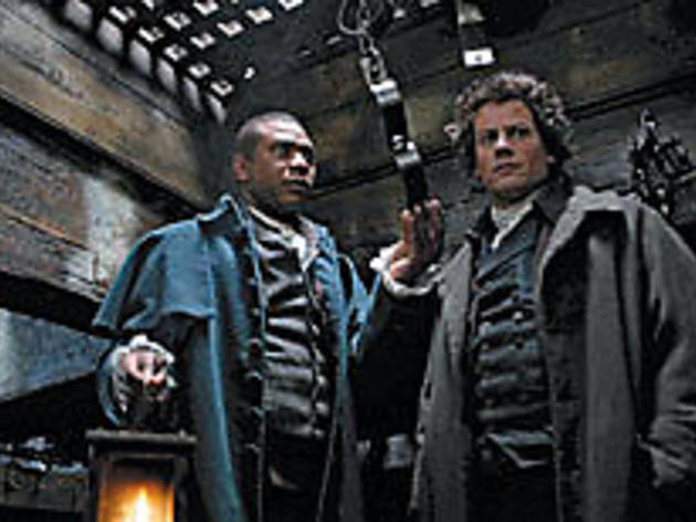 BREAK THOSE CHAINS Gruffudd, right, inspects a slave ship's shackles BREAK THOSE CHAINS Gruffudd, right, inspects a slave ship's shackles.