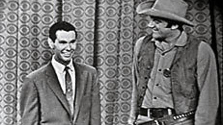 JOHNNY ON THE SPOT Carson, left, and James Arness plug the debut of Gunsmoke