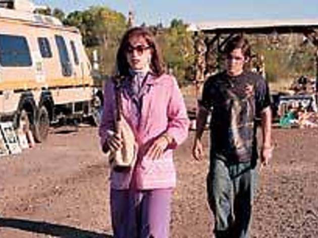 CROSS PURPOSES Huffman, left, sets off alarms with traveling companion Zegers CROSS PURPOSES Huffman, left, sets off alarms with traveling companion Zegers.
