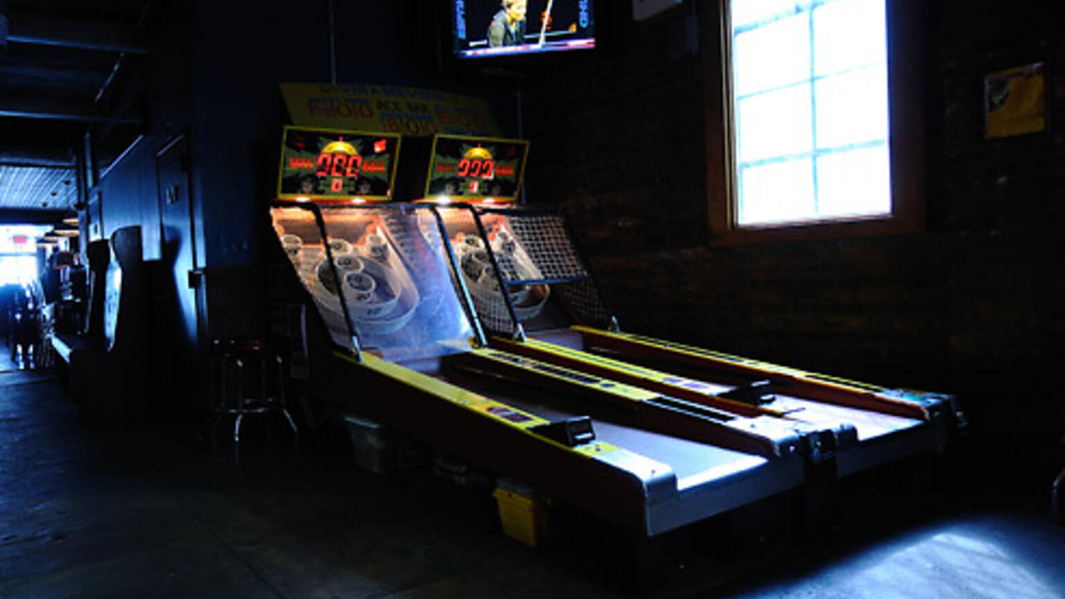 Best bars with games in NYC including arcade bars and bowling