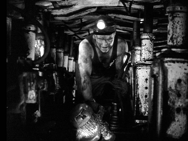 A worker goes underground in The Miners' Hymns A worker goes underground in The Miners' Hymns