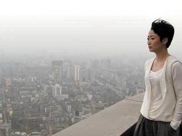 ROOM WITH A VIEW Zhao gazes out at the city of Chengdu ROOM WITH A VIEW Zhao gazes out at the city of Chengdu.