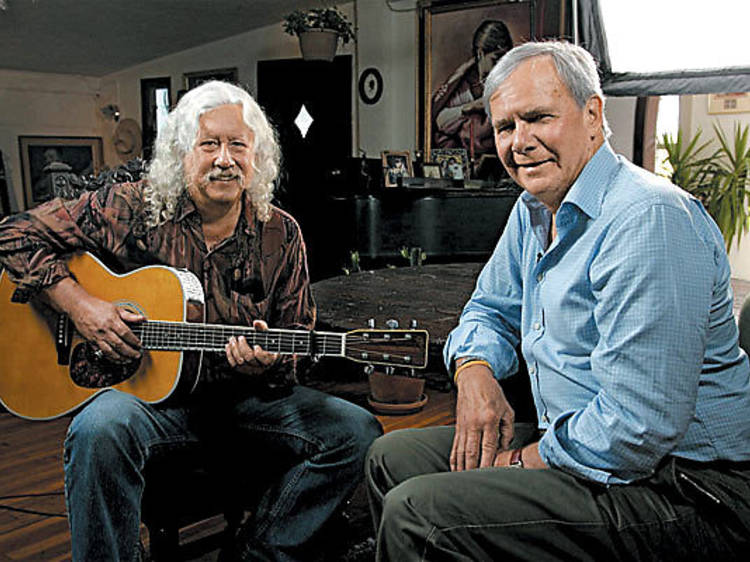 Arlo Guthrie, left, reminisces with Tom Brokaw