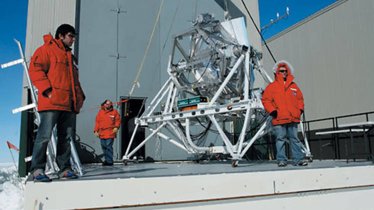 STUDY IN SCARLET Three scientists look after their satellite of love.