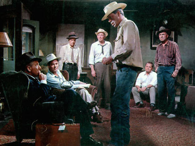 TOWERING INFERNAL Lee Marvin, standing, looms over Tracy TOWERING INFERNAL Lee Marvin, standing, looms over Tracy.