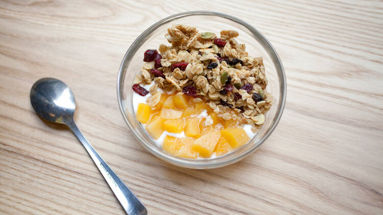 House-made yogurt with granola and seasonal fruit compote at One Girl Cookies