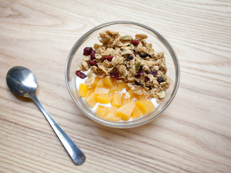 House-made yogurt with granola and seasonal fruit compote at One Girl Cookies