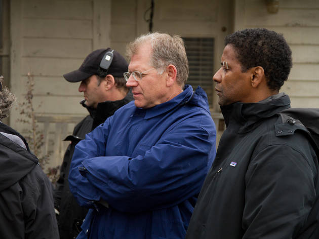 Filmmaker Robert Zemeckis, left, and Denzel Washington check out a shot on the set of Flight