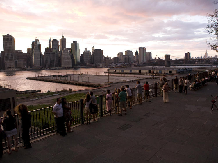 See the lights from the Brooklyn Heights Promenade