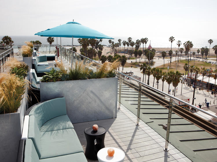 Have a drink at sunset atop the High Rooftop Lounge