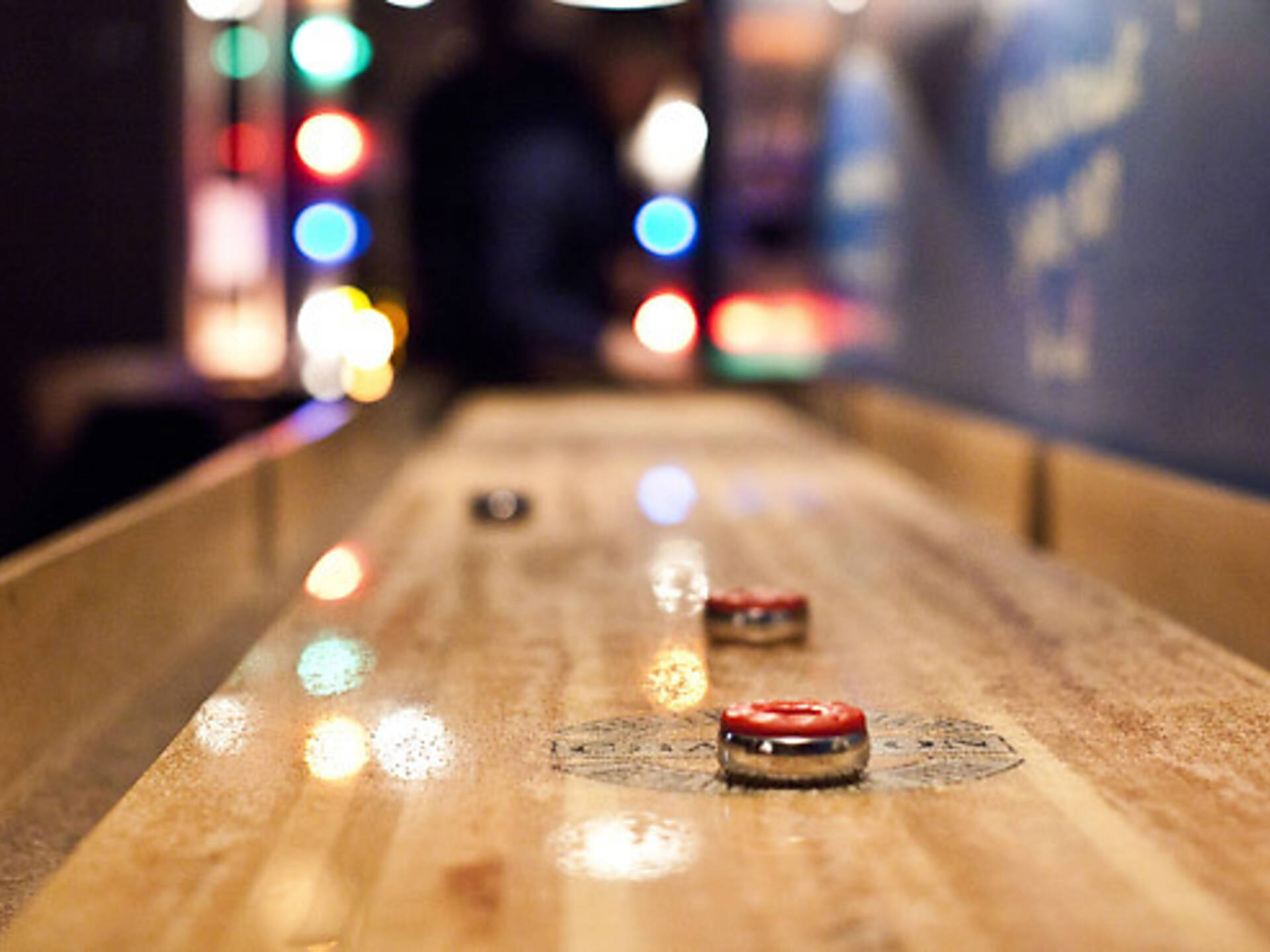 Best bars with games in NYC including arcade bars and bowling