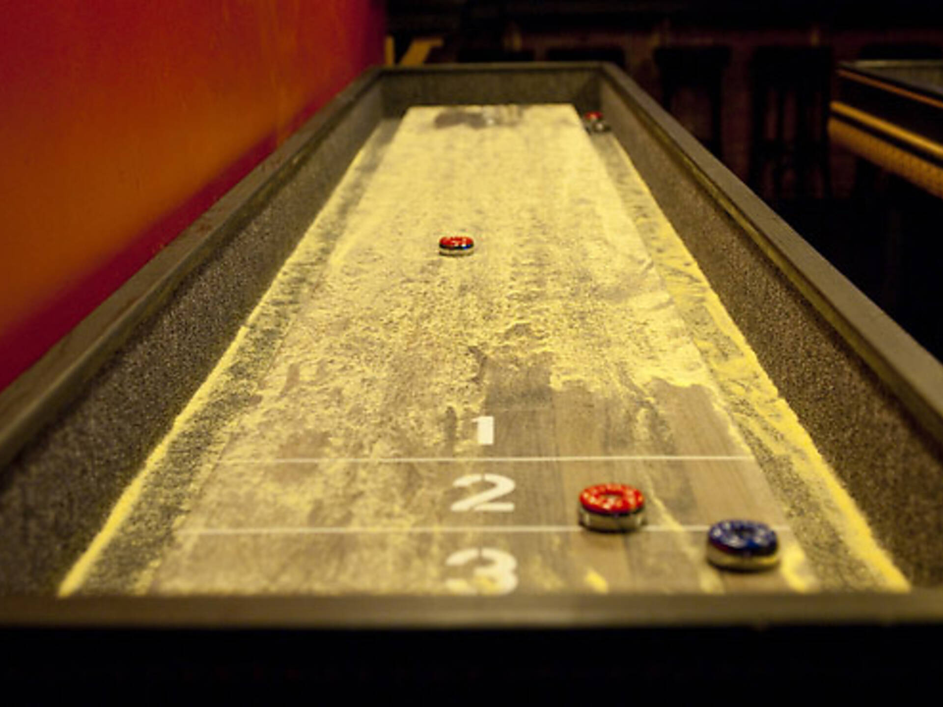 Best bars with games in NYC including arcade bars and bowling