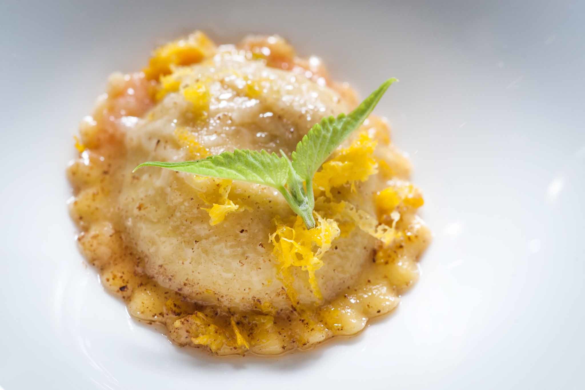 ravioli with lemon zest and a green sprig