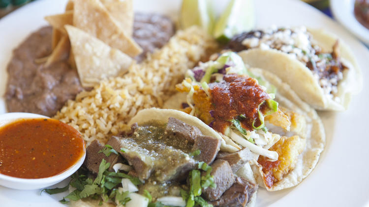 Lengua, fish and chicken mole tacos at Taquería Los Anaya