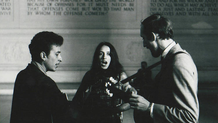 Dan Budnik (Bob Dylan, Joan Baez and Paul Stookey singing a freedom song inside the memorial)