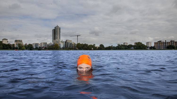 swimmer in urban reservoir