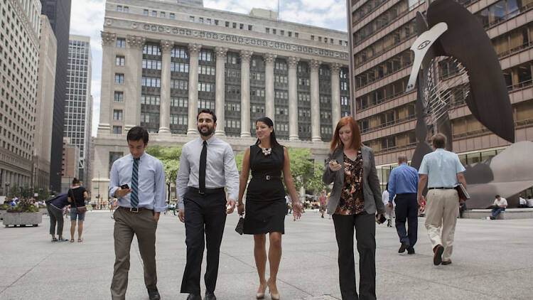 From left, Matthew Fischler, Ankur Thakkar, Anna Valencia, and Caroline Weisser walk through Daley Plaza in Chicago on July 23, 2012.