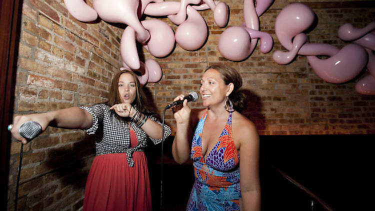 Sing your heart out at a karaoke bar