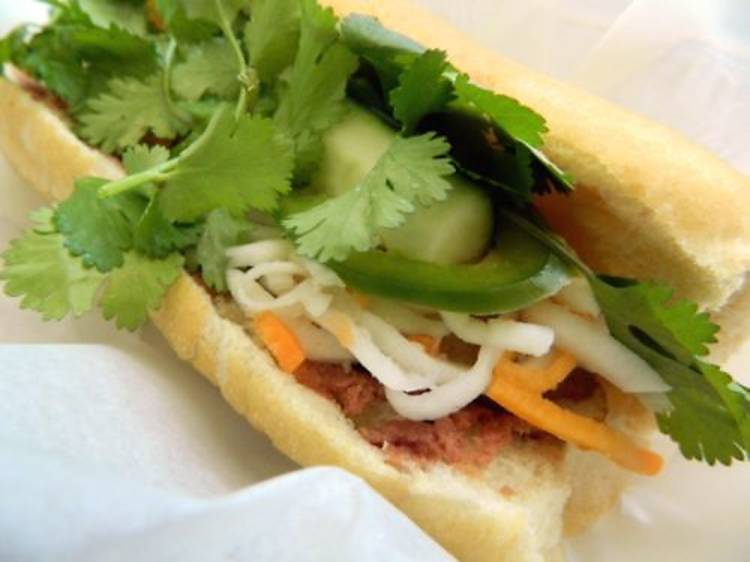 Eat banh mi at Nhu Lan Bakery.