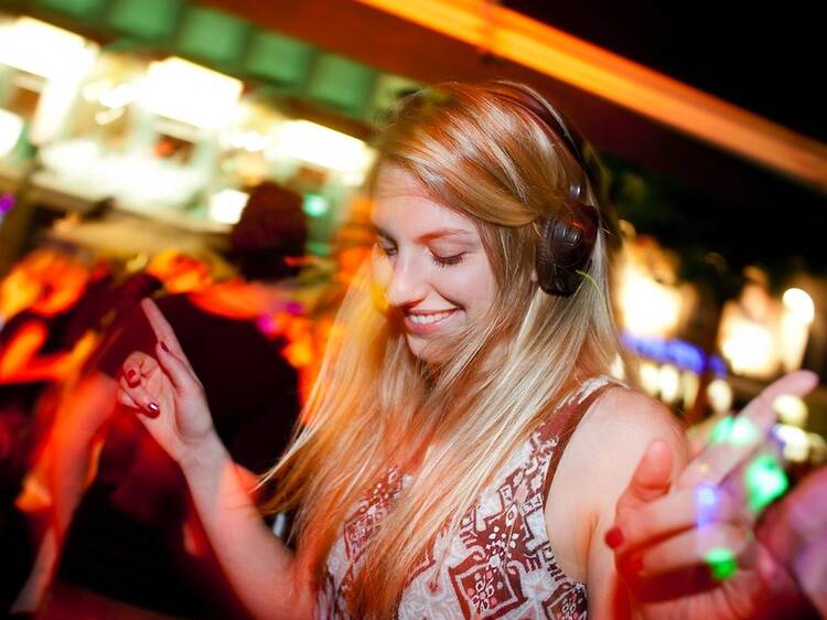 Eva dances during a headphone party at the Club Ullrich in Bochum, Germany, 07 September 2012. So-called 'headphone parties' become increasingly popular in Germany- Eventmanger Speer says that the concept of the 'silent disco' has existed in Germany for a silent disco