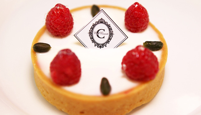 Cheesecake tart on display at Caffe Concerto, a popular Korean cafe in Koreatown Los Angeles