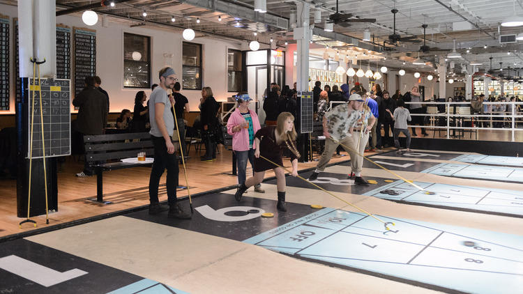 Play shuffleboard at The Royal Palms