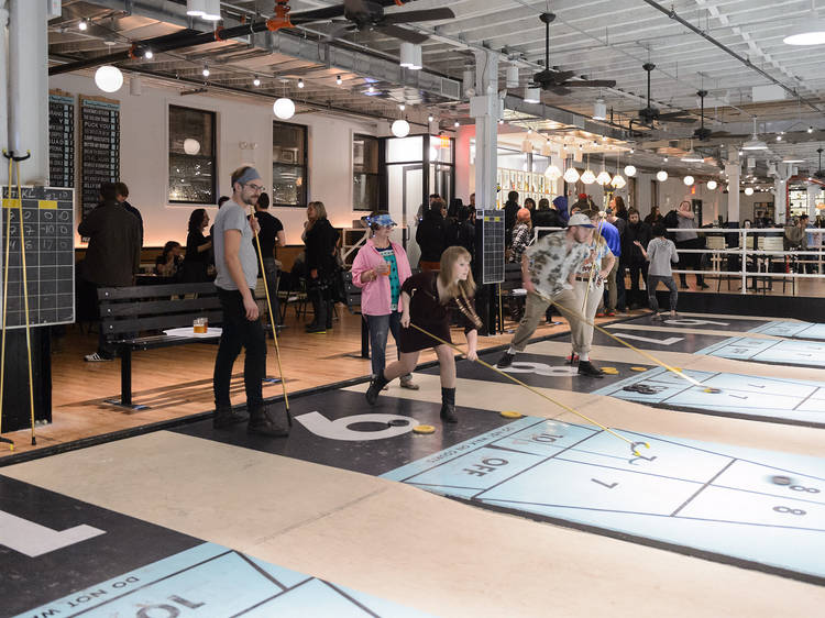 Play shuffleboard at The Royal Palms