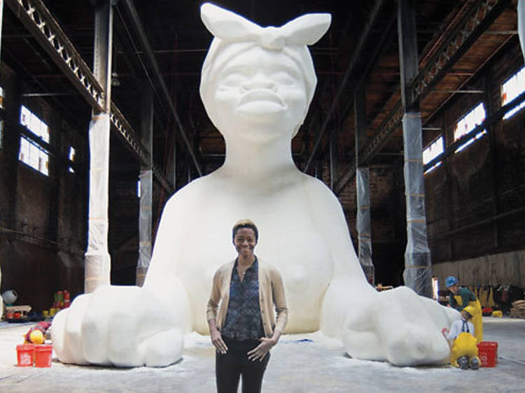 Karen Walker in front of her installation in progress at the Domino Sugar Factory in Brooklyn