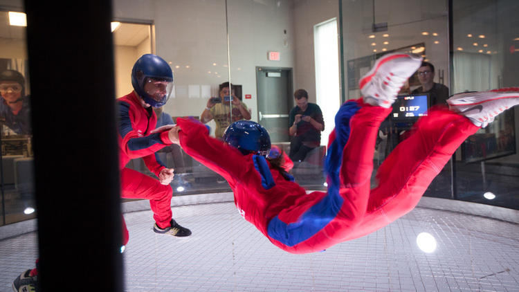 A person going indoor skydiving