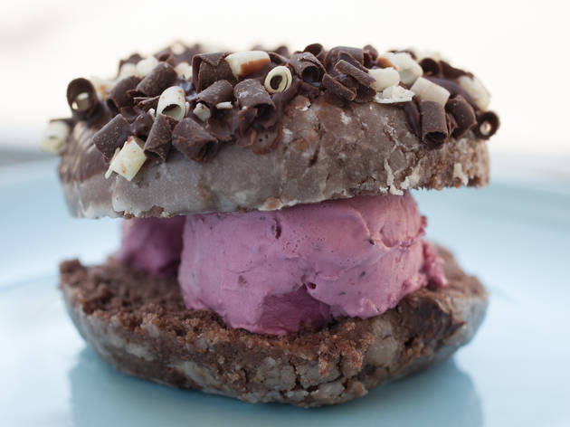 Chocolate donut with blackberry gelato ice cream sandwich at black dog gelato.