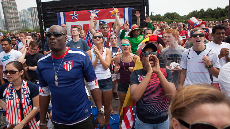 American fans cheer on the U.S. Men's National Team against Germany​ in the final game of World Cup 2014 group play in Grant Park.