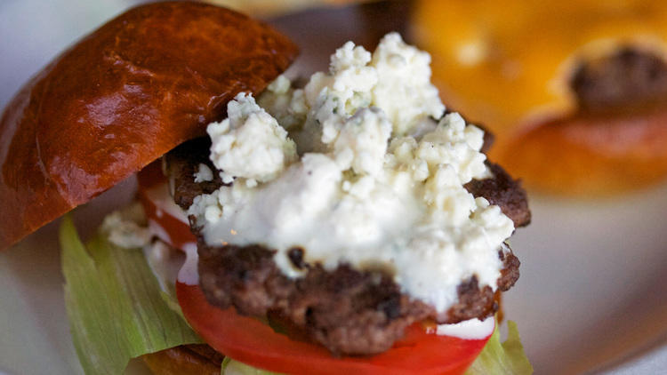 Burger with blue cheese, lettuce and tomato 